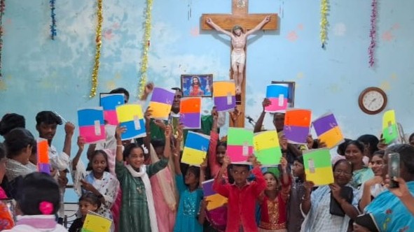 distribution of school materials to the children at endroy in amaravathi parish